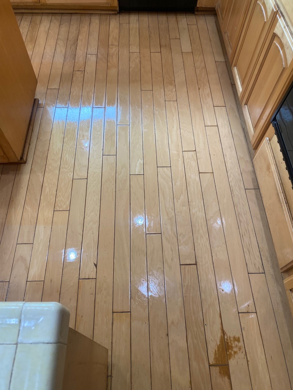 Hardwood floor cleaning in progress